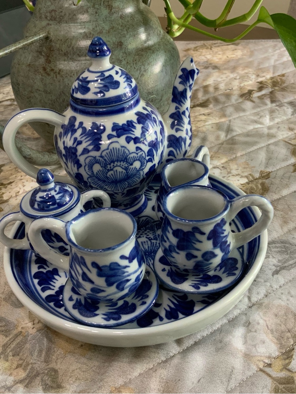 Miniature Blue and White Ceramic Teapot and Cup Set.